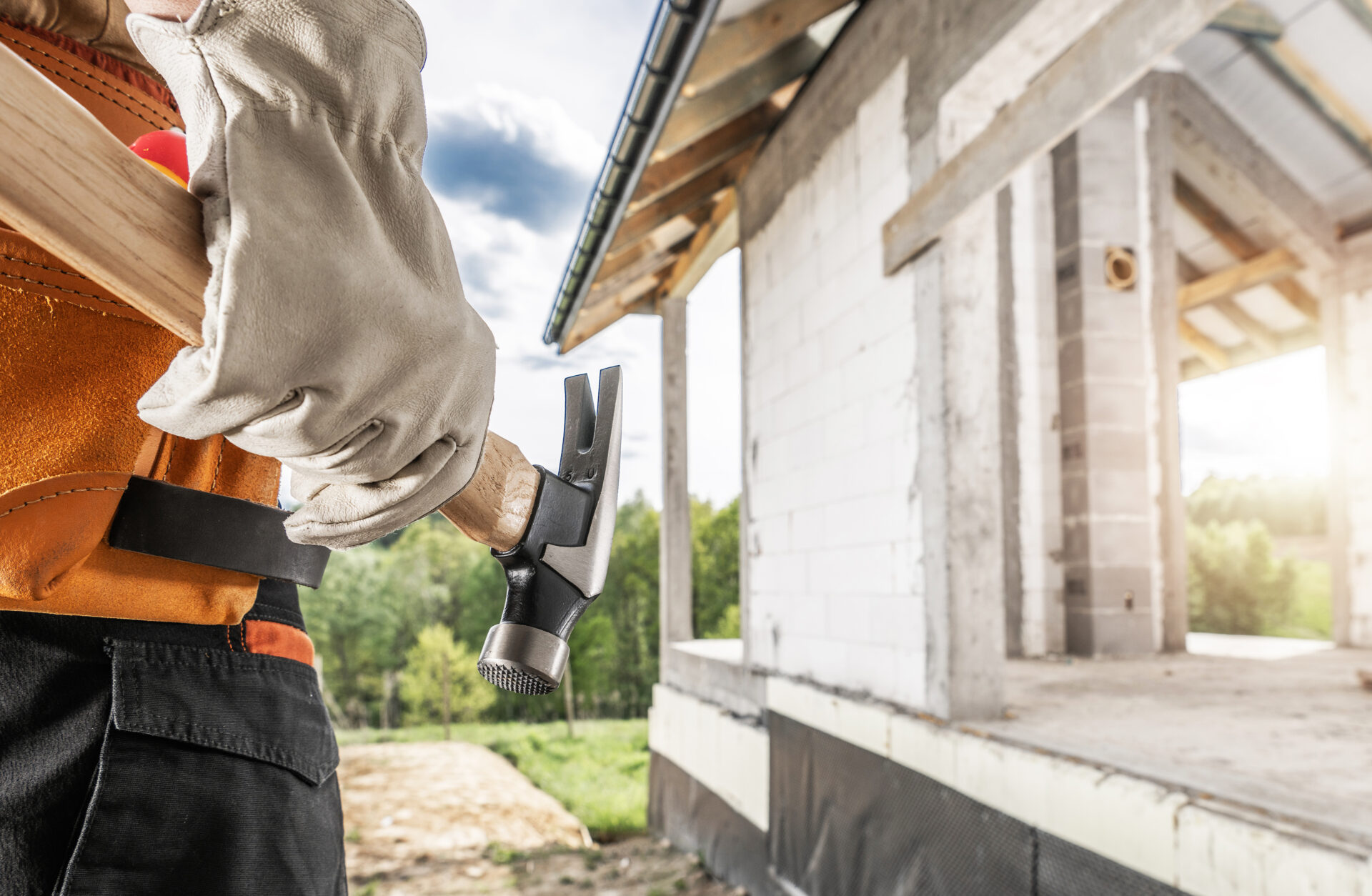 Construction Worker with a Hammer Tool in His Hand
